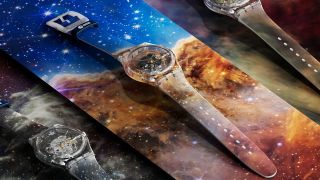 three different watches with stars and galaxies on them