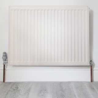room with white radiator on white wall
