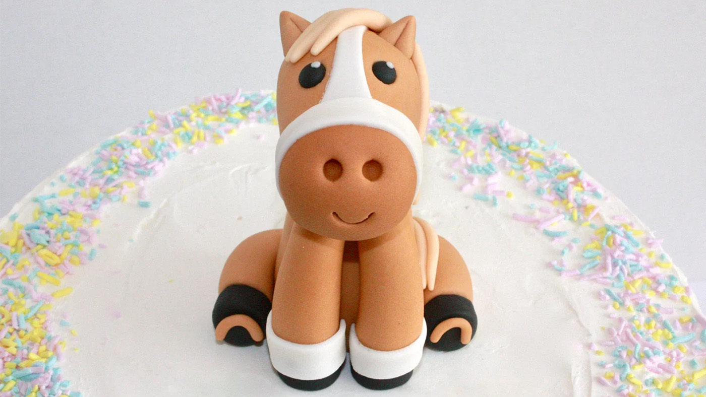 Fondant pony model cake topper