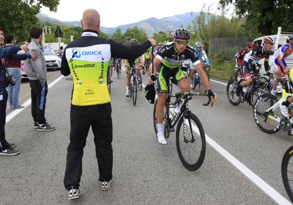 An Orica-GreenEdge rider at the feedzone