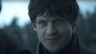 Iwan Rheon wearing an evil smile on the battlefield in Game of Thrones.