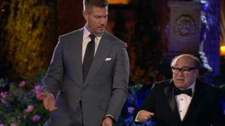 Jesse Palmer standing next to Danny Devito in It's Always Sunny in Philadelphia. 