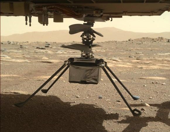 The Mars helicopter Ingenuity with all four legs unfolded, as seen by the Perseverance rover on March 30, 2021. After dropping to the Martian surface April 4, NASA is announcing new helicopter updates April 5. 