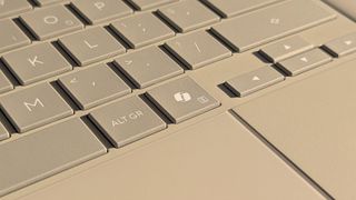 Microsoft Copilot key highlighted on ASUS Zenbook A16 laptop in Zabriskie Beige