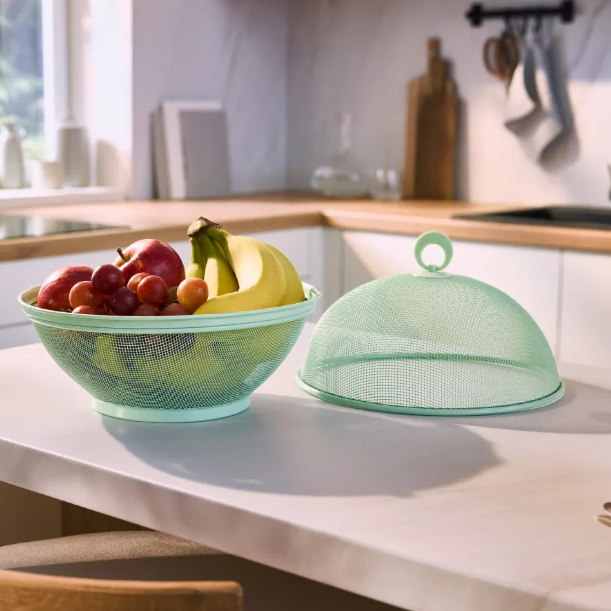 Lidl green metal mesh fruit bowl on kitchen island