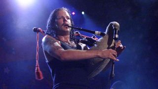 Korn’s Jonathan Davis playing bagpipes onstage