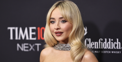 Sabrina Carpenter attends the 2024 TIME100 Next at Current at Pier 59 on October 09, 2024 in New York City wearing a silver chainmail dress