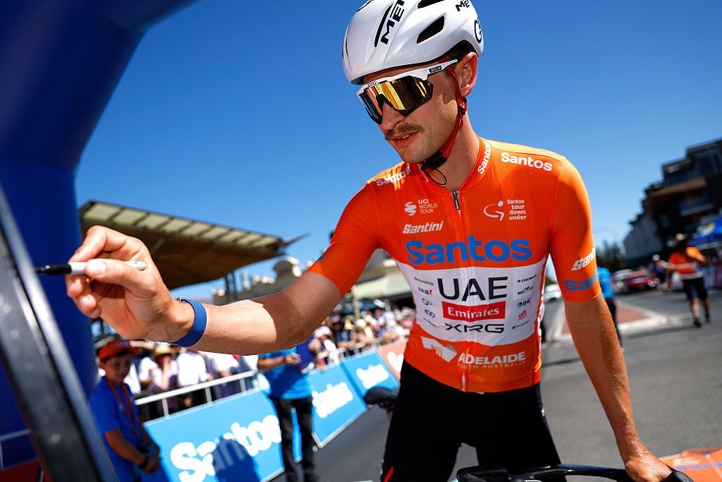 HENLEY BEACH, AUSTRALIA - JANUARY 23: Jay Vine of Australia and UAE Team Emirates - Orange Santos Leader&amp;amp;apos;s Jerseyprior to the 26th Santos Tour Down Under 2026, Stage 3 a 140.8km stage from Henley Beach to Nairne / #UCIWT / on January 23, 2026 in Henley Beach, Australia. (Photo by Con Chronis/Getty Images)