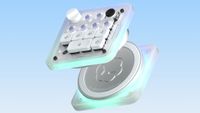 An Open AI/Work Louder collaboration mini keyboard called the Codex Micro, split apart on a sky blue background