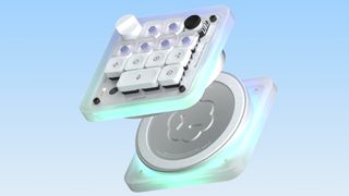 An Open AI/Work Louder collaboration mini keyboard called the Codex Micro, split apart on a sky blue background