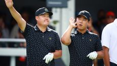 Sungjae Im of South Korea and Tom Kim of South Korea and the International Team acknowledge the crowd on the first tee during Thursday's Four-ball matches on day one of the 2024 Presidents Cup at The Royal Montreal Golf Club on September 26, 2024 in Montreal, Quebec, Canada.