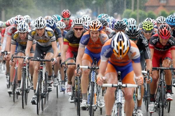 Philippe Gilbert (Omega Pharma Lotto) sits in the peloton over wet roads