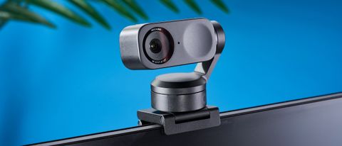 a photograph of a small grey 4K webcam with a gimbal and PTZ functionality