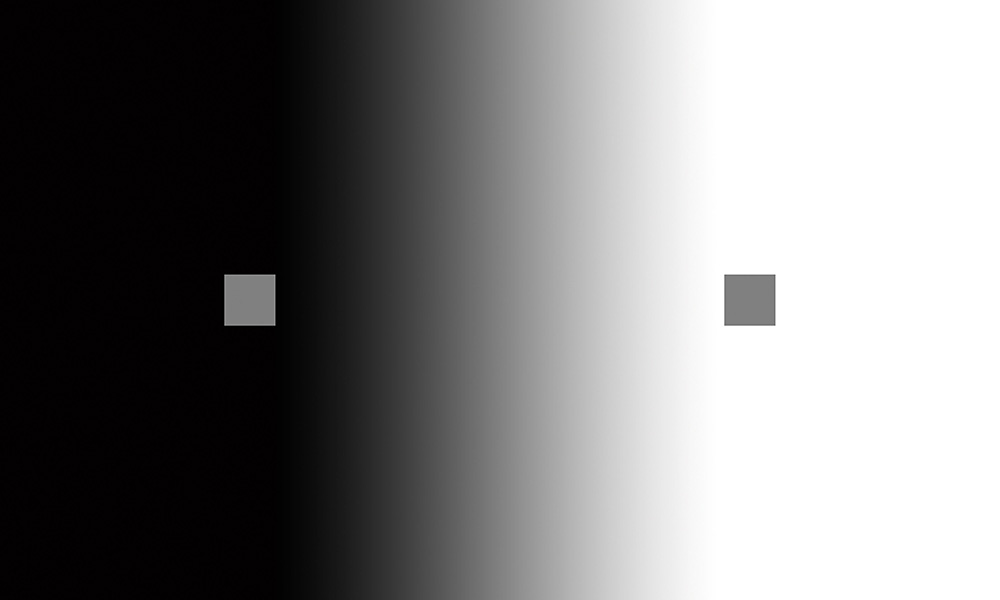 Tonal values: Two grey scares on a gradient background moving from black to white