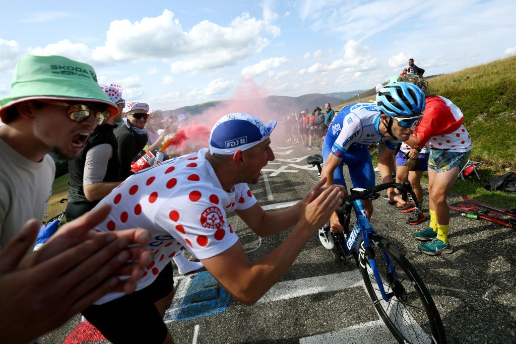 Chris Harper (Jayco AlUla) climbs the Le Markstein surrounded by cheering fans