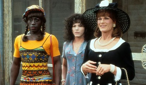 To Wong Foo Wesley Snipes John Leguizamo and Patrick Swayze stand on the front porch, in drag