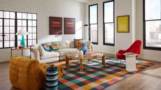 modern living room with white walls, large windows and multi-coloured checked large rug