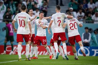 Piotr Zielinski with his Poland team-mates after scoring against Saudi Arabia at the 2022 World Cup.