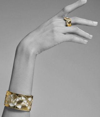 Judith Ripka gold bracelet worn on a model