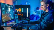 Teen boy playing a first-person shooter video game.