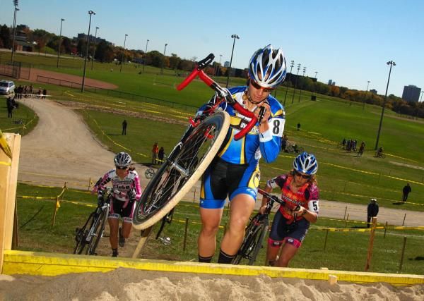 Pepper Harlton over the barriers on the first lap.