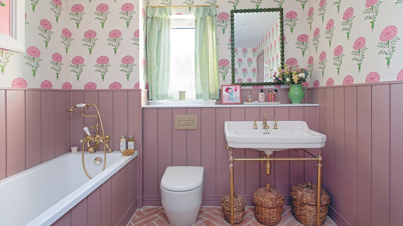 Bathroom with pink panelling and wallpaper