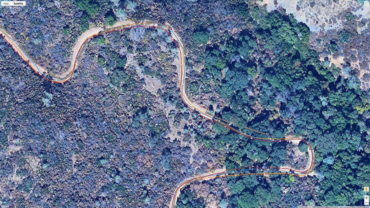 A GPS map of a hike from the COROS VERTIX 2S (orange line), Garmin Forerunner 965 (blue line), and Polar Vantage V3 (brown line).