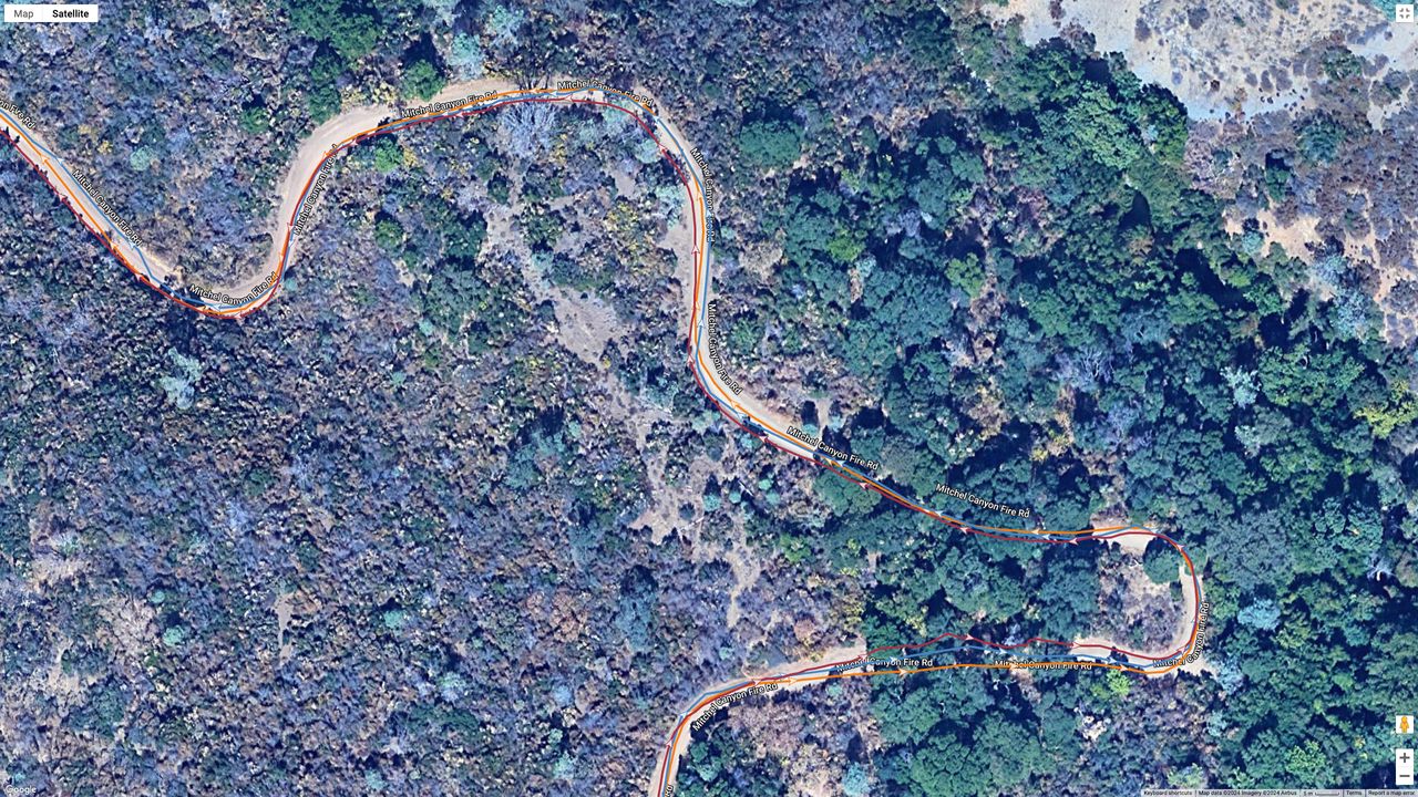 A GPS map of a hike from the COROS VERTIX 2S (orange line), Garmin Forerunner 965 (blue line), and Polar Vantage V3 (brown line).