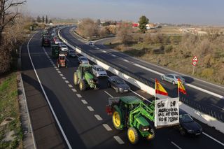 GRANADA SPAIN FEBRUARY 6 Farmers drive tractors to block the main roads of Granada during the protests of the farmers in region of Andalusia against European agricultural policy and denounce the precariousness in the sector in Granada Spain on February 6 2024 Photo by Alex CamaraAnadolu via Getty Images
