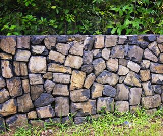 Retaining wall fence alternative