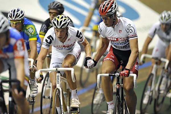 Iljo Keisse is swung into the fray by Roger Kluge.