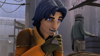 Screenshot from the animated T.V. show Star Wars Rebels. Teenager Ezra Bridger (male, shoulder-length dark blue hair, thick dark eyebrows) is leaning forward and speaking into a silver communication device in his right hand. He is wearing an orange jumpsuit with brown shoulder pads and gloves. He appears to be in some kind of market.