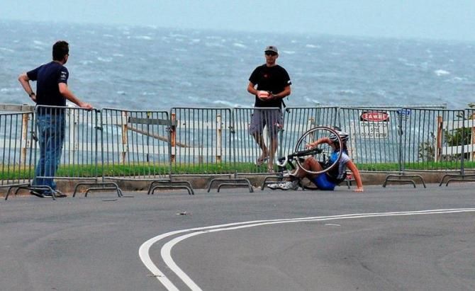 A rider hits the ground in the women's race