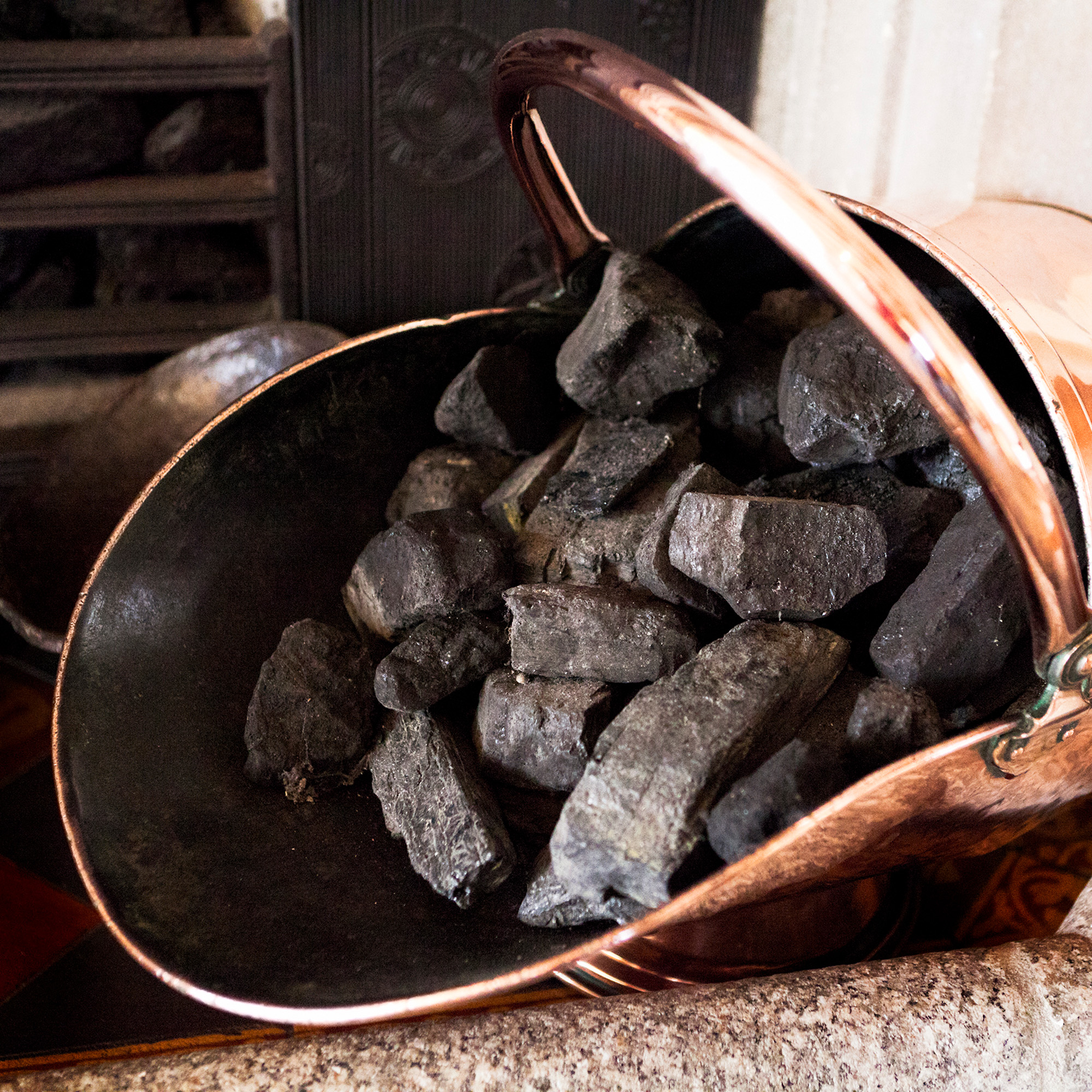 coal in a copper scuttle