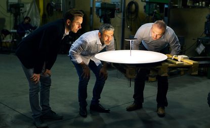 Mike Holland, Ettore Cimini and James White check out the ‘Dot’ lamp at the Lumina factory