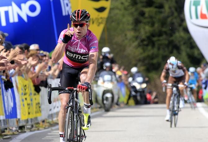 Cadel Evans celebrates withi his usual understated salute after winning stage 3 of Giro del Trentino