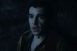 christopher abbott looks shocked in a dark still from the movie wolf man