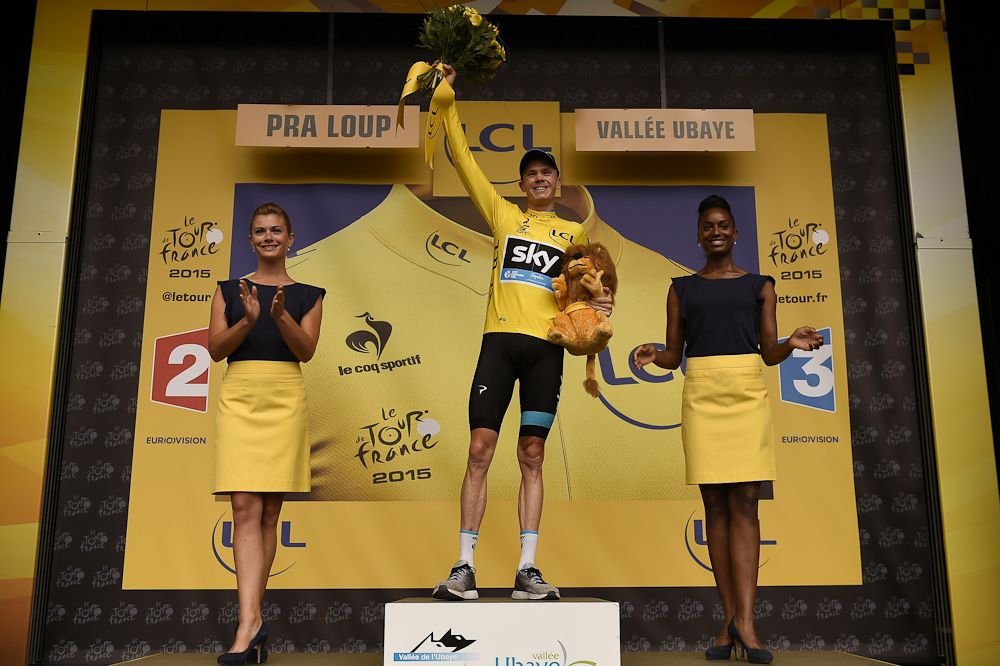 Chris Froome in yellow on the stage 17 podium.