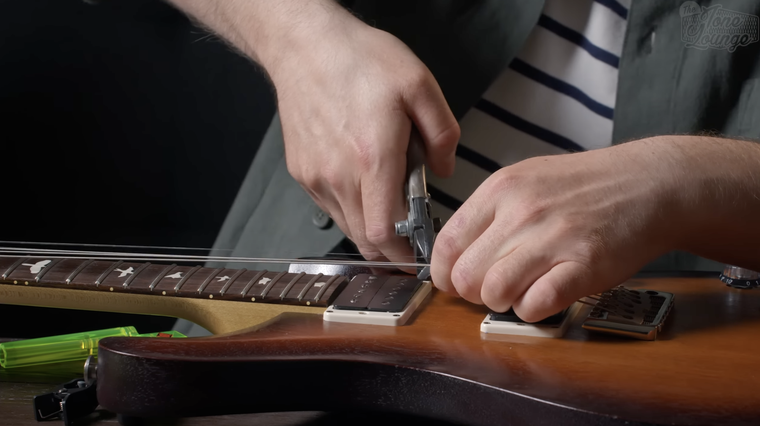 Cutting strings near the guitar bridge