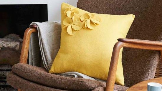 armchair with yellow cushions