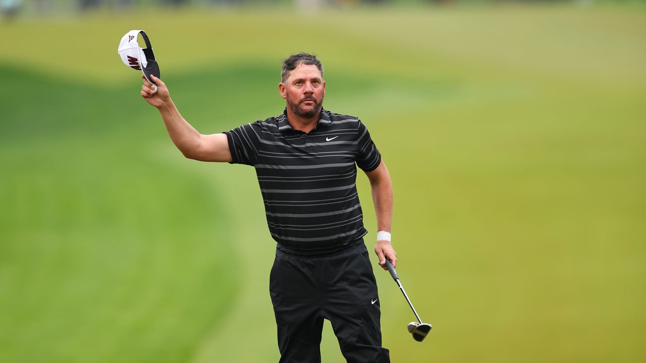 Michael Block of the Corebridge Financial PGA Team waves to the crowd on the 18th hole during the third round of the PGA Championship at Oak Hill Country Club