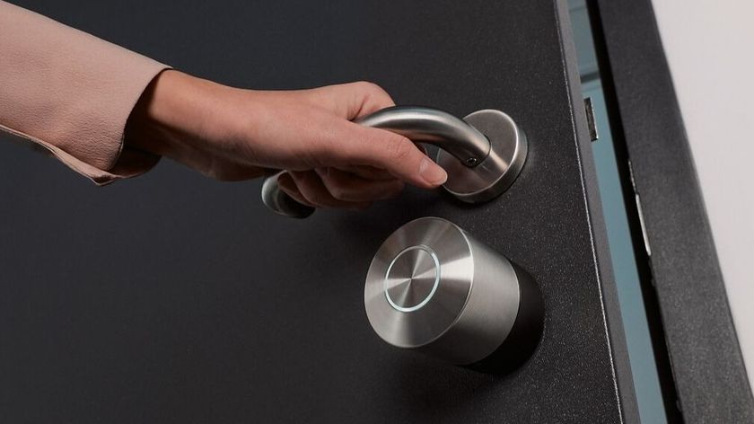 Person opening door fitted with Nuki Smart Lock Pro (5th Gen)