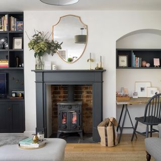 grey living room with black painted alcove and black fireplace