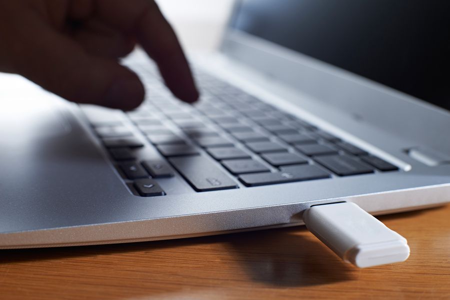 A USB stick being inserted into a unsuspecting user&amp;#039;s laptop