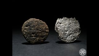 These silver ornaments, known as ear spools, were among the grave goods interred in the tomb with the seven people who were buried there about 1,300 years ago.