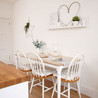 kitchen dinning area with wooden flooring dish and wooden chair