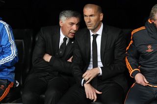 Real Madrid manager Carlo Ancelotti speaks to assistant manager Zinedine Zidane on the bench during the 2013/14 Champions League quarter-final first leg against Borussia Dortmund