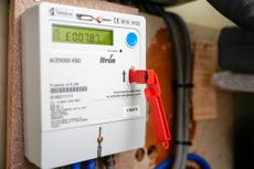 A prepay electricity key sits in a prepayment electricity meter in a home