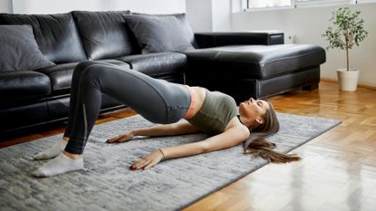 Woman works out her abs and glutes