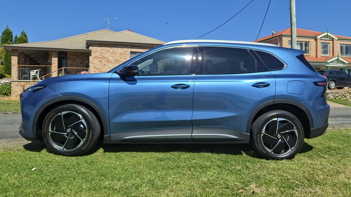 The MG S5 parked on some grass in a suburban neighbourhood